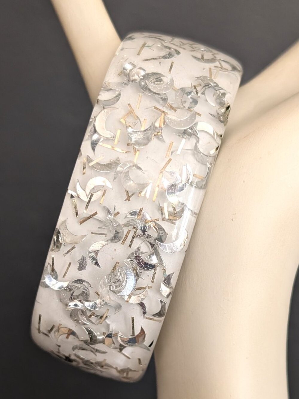 White and clear resin cuff bracelet with silver confetti-like accents